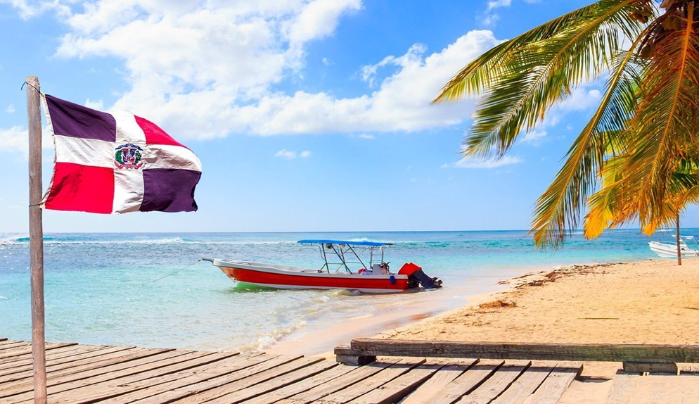 Dominican Republic beach with flag